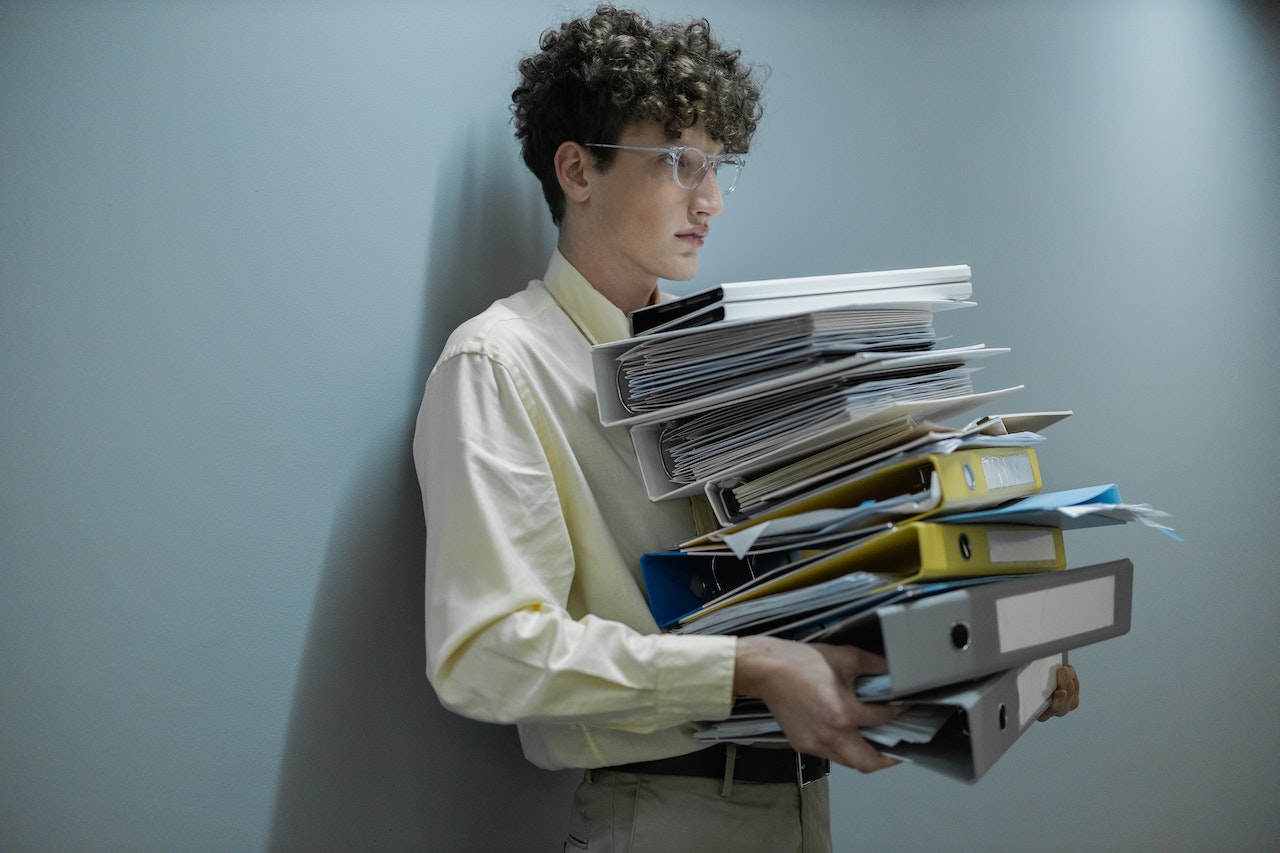 Free Man in White Dress Shirt Reading Books Stock Photo