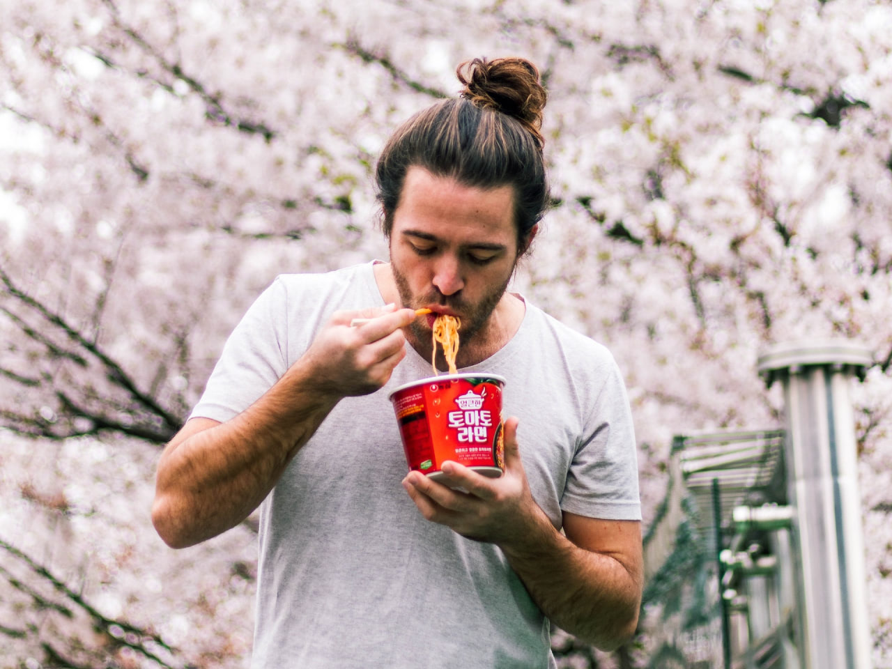 Man Eating Instant Noodles